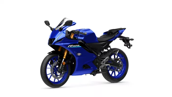 Blue sport motorcycle shown from a three-quarter front-left angle, featuring a blue fairing, gold front forks, and a racing-style windscreen (Yamaha R125 badge visible).