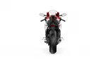 Rear view of a red-and-white sport motorcycle with prominent taillight and wide rear tire on a white background
