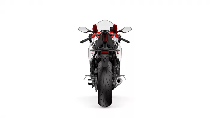 Rear view of a red-and-white sport motorcycle with prominent taillight and wide rear tire on a white background
