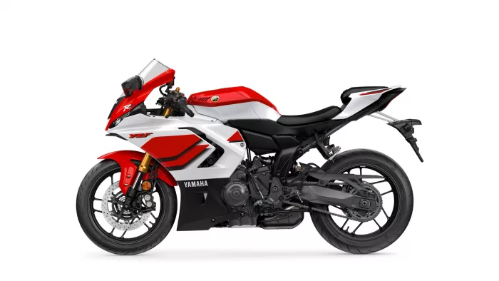 Red-and-white Yamaha sport motorcycle shown in profile with branding visible on fairings and wheel detail