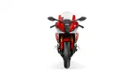 Front view of a red and white Yamaha R1 sport motorcycle with windshield and prominent headlight area.