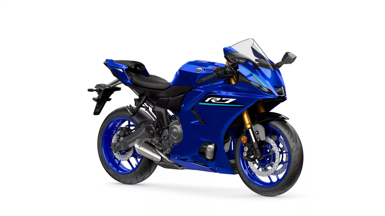 Blue Yamaha R7 sport motorcycle shown in a front-right three-quarter view with gold front forks and aero fairing, logo visible on side panel.