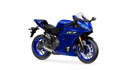 Blue Yamaha R7 sport motorcycle shown in a front-right three-quarter view with gold front forks and aero fairing, logo visible on side panel.