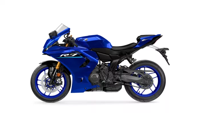 Blue Yamaha R1 sport motorcycle shown from the left side, highlighting the fairing and indicators on a white background.