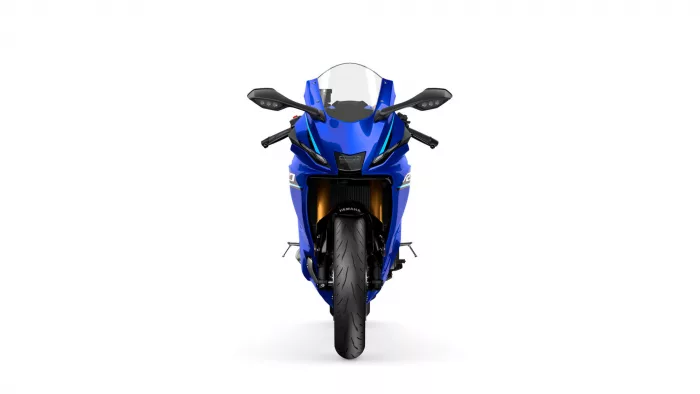 Front view of a blue Yamaha sport motorcycle on a white background, showing the windshield and handlebars from the rider's perspective.