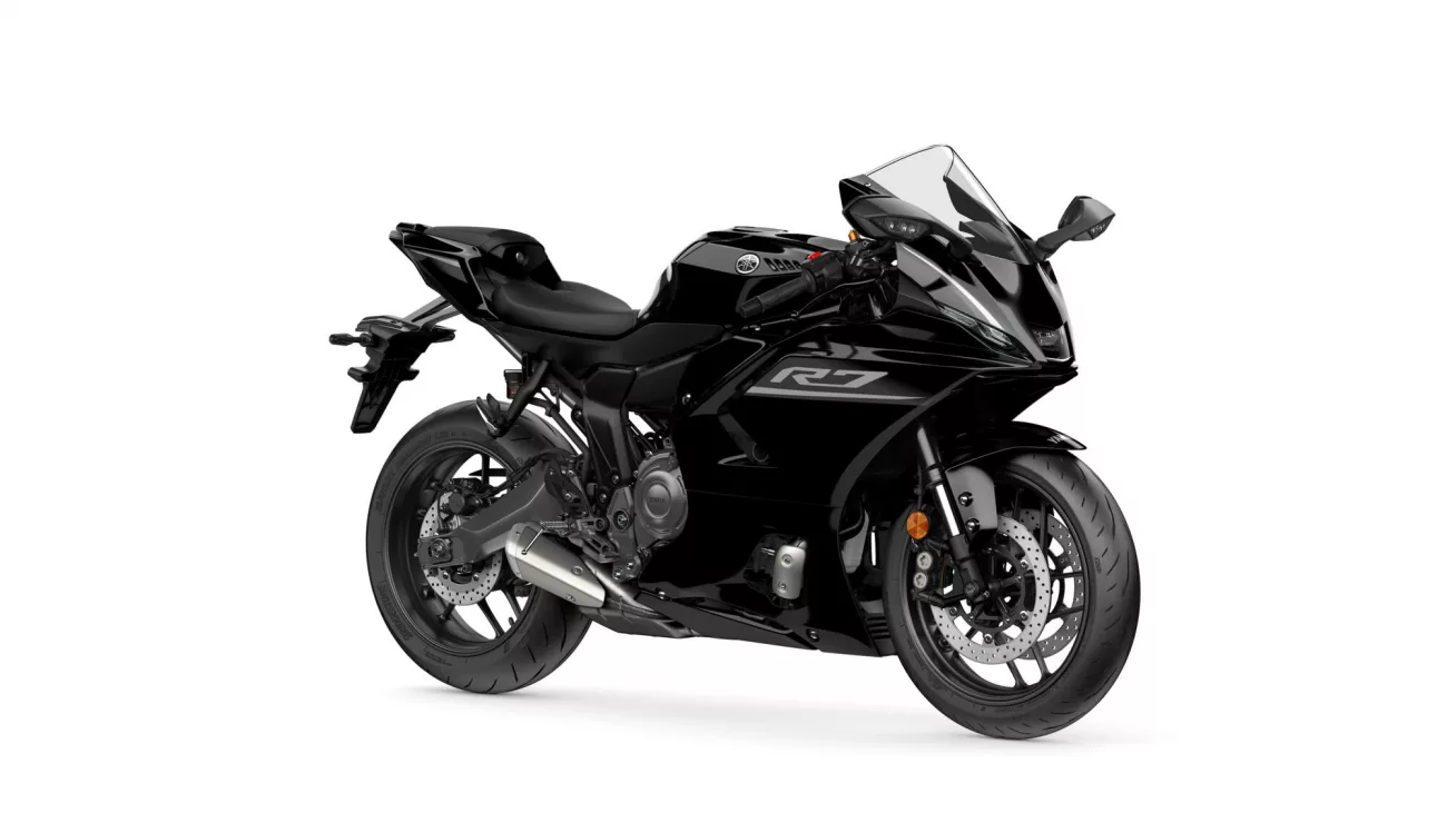Black sport motorcycle photographed from the right side with a clear windshield and angular fairings.