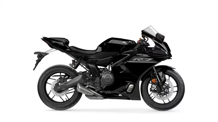 Black Yamaha sport motorcycle in side view, showcasing sleek fairing, low seat, and dual front discs.
