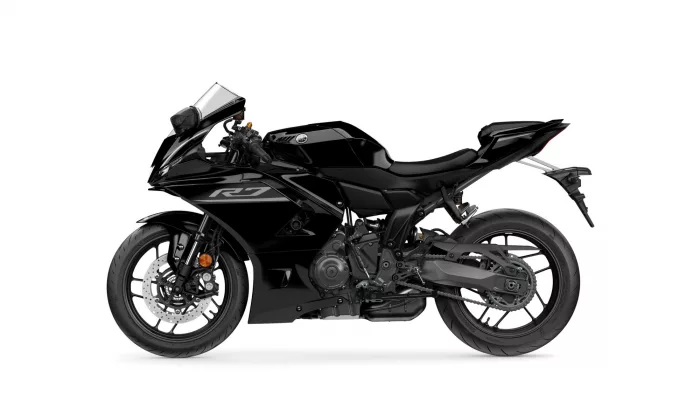 Black sport motorcycle seen from the left side, featuring a sleek angular body and a prominent fuel tank with a Yamaha logo and 'R3' decal
