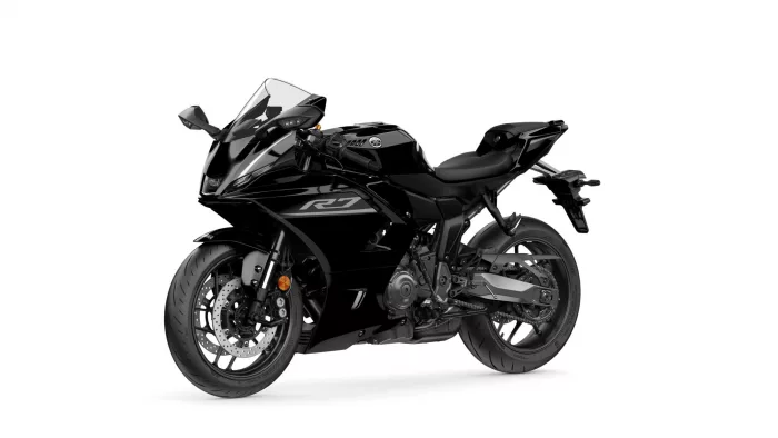 Black sport motorcycle photographed from a left-rear angle, showing sleek fairing, windscreen, and wheel details with Yamaha branding visible