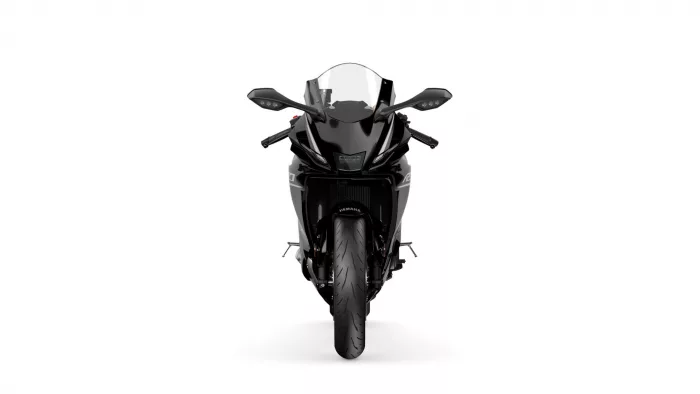 Front view of a black Yamaha sport motorcycle with a clear windshield and aggressive styling