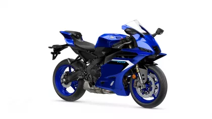 Blue Yamaha sport motorcycle shown from a right-front angle with aerodynamic fairings and large disc brakes.