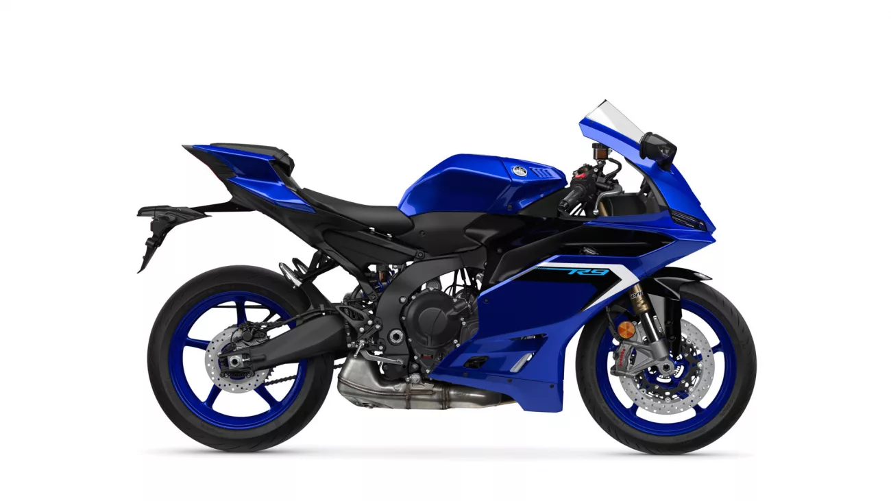 Blue sport motorcycle shown in a side profile, featuring sleek aerodynamic fairings, black chassis, and blue rims.