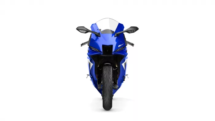 Front view of a blue Yamaha sport motorcycle with a clear windshield and aggressive styling
