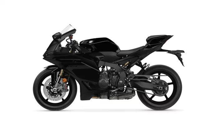 Black sport motorcycle in a left-side profile view with angular fairings and large rear wheel against a white background.