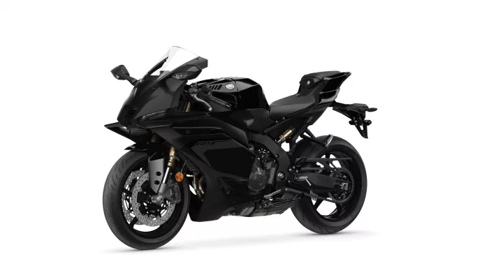 Black sport motorcycle shown from a left-front angle with a sleek fairing and windscreen, Yamaha logo visible on the tank