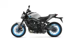 Side view of a gray sport motorcycle with bright blue rims and exposed mechanicals.
