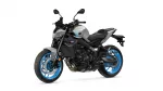 Sport motorcycle shown from a front-left angle, silver body with bright blue rims and black frame parts.