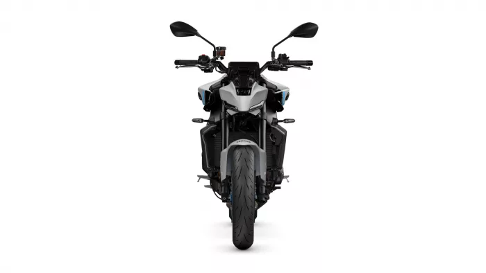 Front view of a black-gray sport motorcycle with wide front tire and dual mirrors on handlebars.