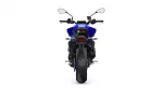 Rear view of a blue sport motorcycle, showing the wide rear tire, taillight, and mirrors behind the rider position