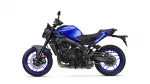 Blue sport motorcycle photographed from the left side, showing blue fuel tank and black frame against a white background