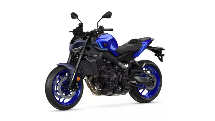 Blue sport motorcycle photographed from a front-right side, showing blue bodywork, black frame, and blue rims with disc brakes (Yamaha logo visible).