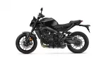 Left-side profile of a sleek black sport motorcycle with a sharp fuel tank and exposed engine components.