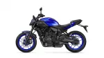 Left-side view of a blue Yamaha MT-07 sport motorcycle with black frame and bright blue rims, shown against a white background, highlighting the engine and exhaust.
