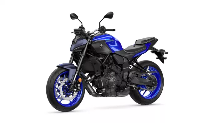 Blue Yamaha MT-07 sport motorcycle photographed from front-left, showing blue bodywork, black frame, and disc brakes.