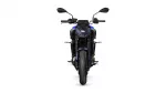 Front view of a blue sport motorcycle facing the camera, showing the windshield, twin headlights and wide front tire, with black accents and mirrors visible.