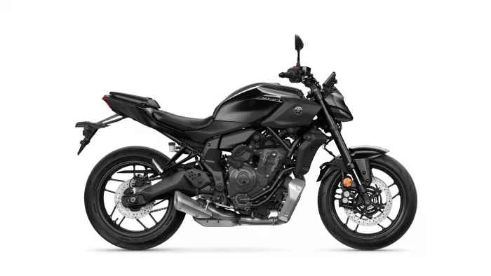 Left-side view of a black Yamaha MT-07 sport motorcycle, showing the engine, exhaust, and disc brakes.