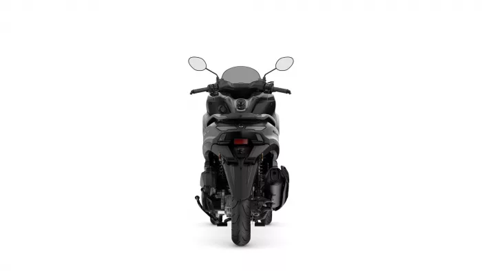 Rear view of a black/silver motorcycle showing taillight, seat, and rear wheel from behind.