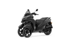 Gray Yamaha three-wheeled scooter with windshield and two-seat configuration, shown from a side-front angle on a white background.