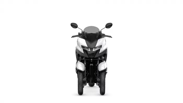 Front view of a white-and-black sport motorcycle with windshield and mirrors on either side