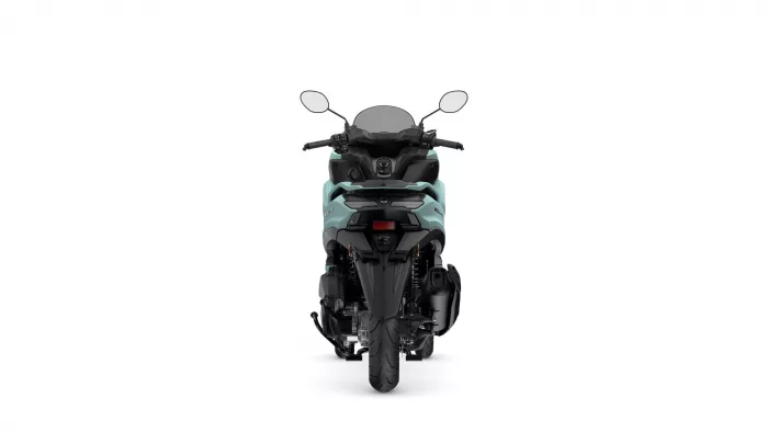 Rear view of a teal and black motorcycle scooter on a white background, showing mirrors and tail area.