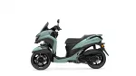 Light teal Yamaha scooter shown in profile, front windshield and seat visible, highlighting its modern design.