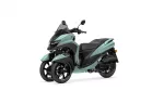 Teal Yamaha Tricity three-wheeled scooter shown from the front-left, with a tall windscreen and black seat.