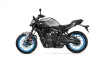 Yamaha MT-07 sport motorcycle in gray and black with bright blue wheels, side view on white background.