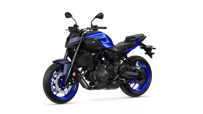 Blue Yamaha MT-07 sport motorcycle shown in a side-angle view with exposed engine and blue rims against a white background