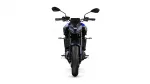 Front view of a blue sport motorcycle with dual headlights, mirrors, and a wide front tire.