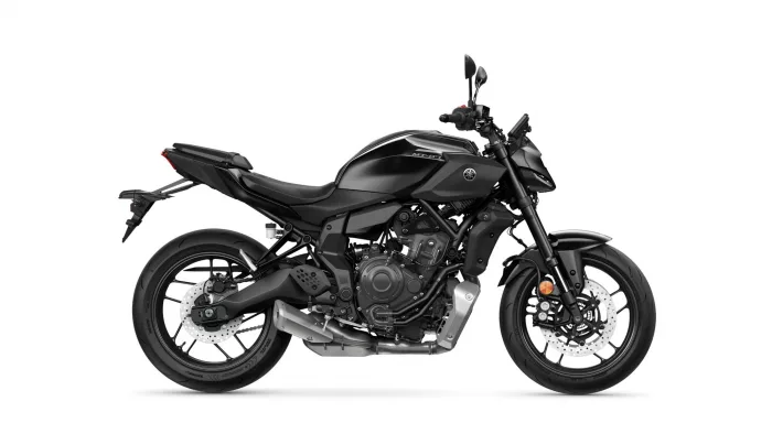 Black Yamaha MT-07 motorcycle in side profile, showing front wheel, engine, and exhaust against a white background.