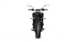 Rear view of a black sport motorcycle centered on a white background, showing taillight, exhaust, and rear tire