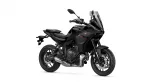 Black Yamaha sport motorcycle shown from the front-right, with a tall clear windscreen and aggressive angular fairing.