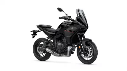 Black Yamaha sport motorcycle shown from the front-right, with a tall clear windscreen and aggressive angular fairing.