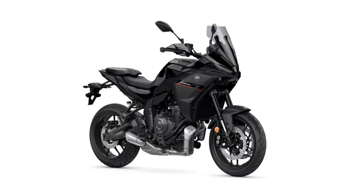 Black Yamaha sport motorcycle shown from the front-right, with a tall clear windscreen and aggressive angular fairing.