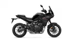 Black Yamaha Tracer sport-touring motorcycle in side view, showing windscreen and body fairings.