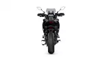 Rear view of a black sport motorcycle showing taillight, rear fender, and wide tire.