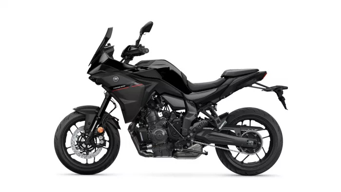 Black Yamaha Tracer sport motorcycle in profile view, showing the fairings, handlebars, and rear wheel on a white background.