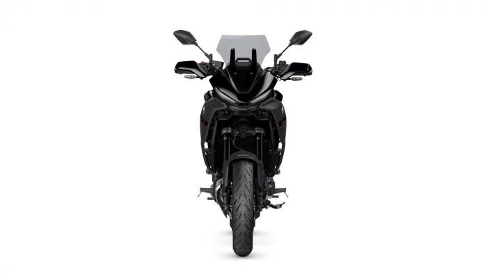 Front view of a black Yamaha motorcycle with a windshield, mirrors, and dual headlights, seen head-on against a white background.