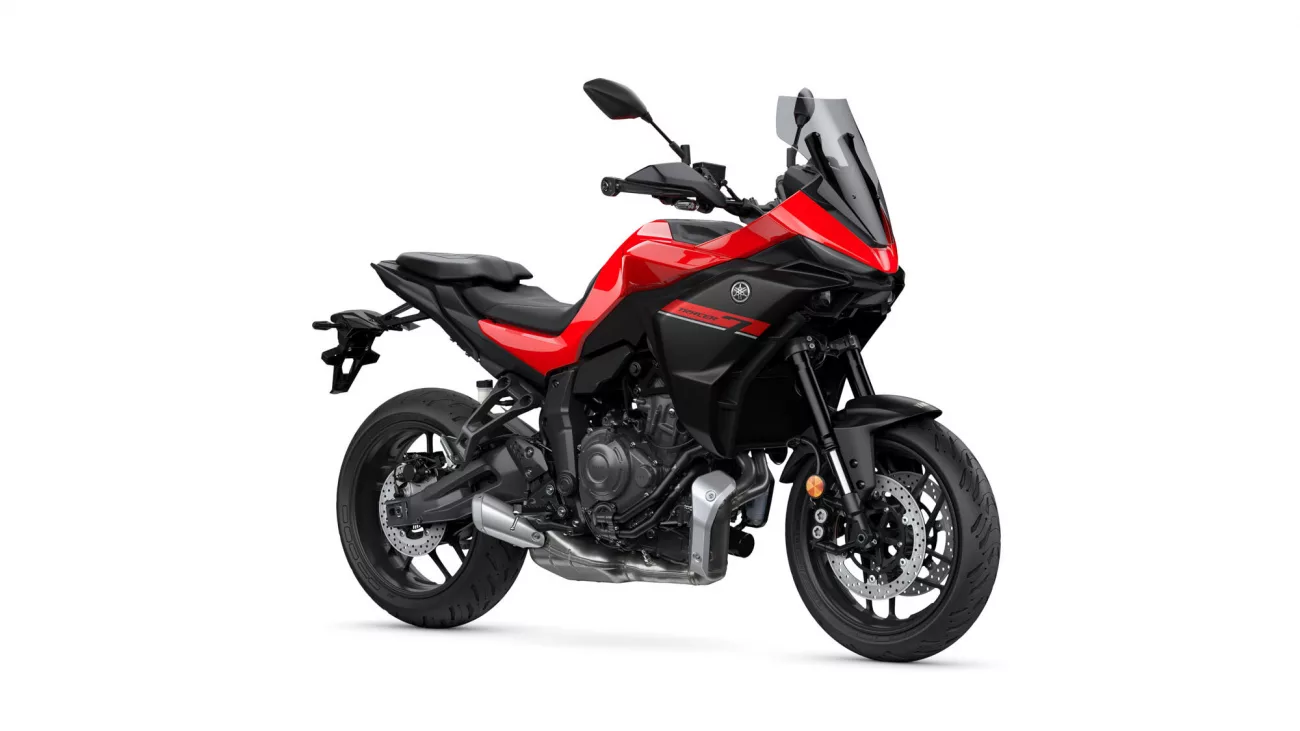 Red and black Yamaha Tracer 7 motorcycle shown in a three-quarter front view against a white background