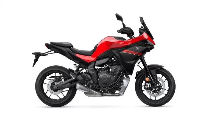 Red and black Yamaha Tracer 7 sport-touring motorcycle photographed in profile against a white background.